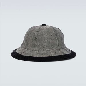 Brand: BODE. Paneled wool herringbone bucket hat in gray. Cotton corduroy trim.